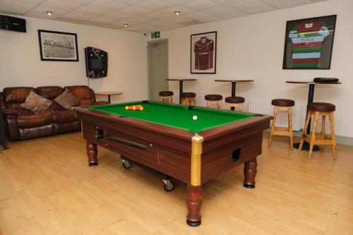 a room with a pool table in a room at Greenfield Lodge Hotel Bar & Bistro in Headford