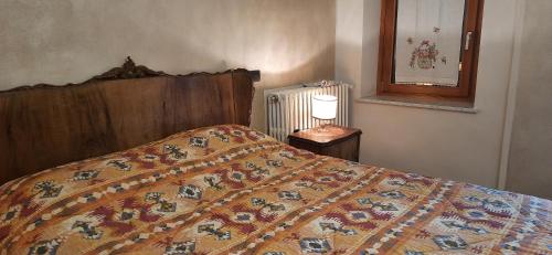 Säng eller sängar i ett rum på Il Giardino del Gallo