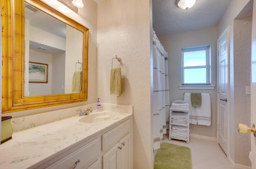 a bathroom with a sink and a mirror at Spacious Livingston Home with Private Boat Dock in Livingston
