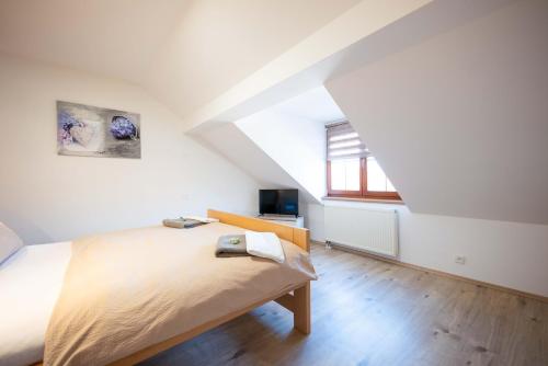 Postel nebo postele na pokoji v ubytování PAPI Apartmán