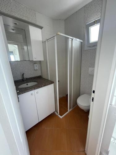 a bathroom with a shower and a sink and a toilet at PLEASENT SUNSET in CESME-SITE SOLEY 17 in Çeşme