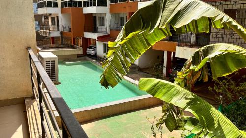 an overhead view of a swimming pool on a building at Pebbles 2BHK Home By Goaround Homes in Siolim