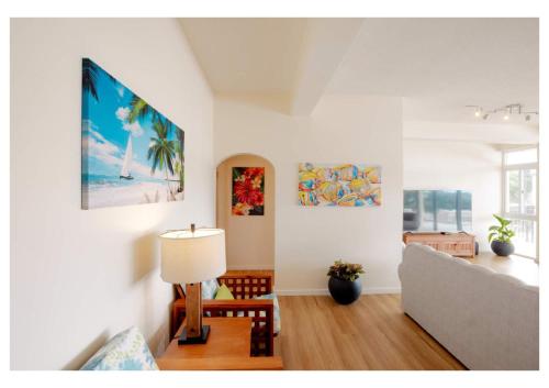 a living room with a couch and a lamp at Sauna Pool Game Room Bliss in Rodney Bay Village