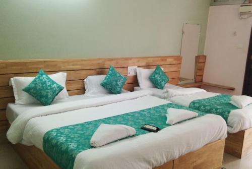 Voodi või voodid majutusasutuse Hotel Sea Rock Porte Blair toas