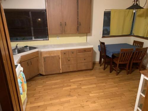 a kitchen with a table and a table and chairs at Pearl Cove in Santa Cruz