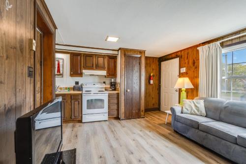 a living room with a couch and a kitchen at The Inn at Lewes in Rehoboth Beach