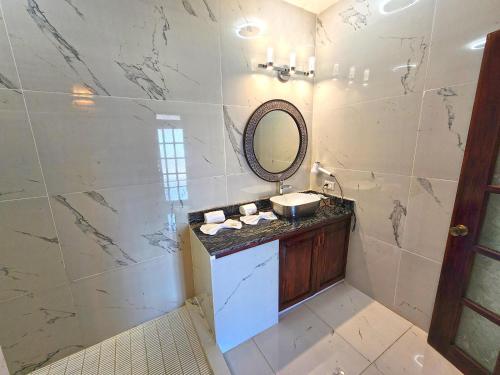 a bathroom with a sink and a mirror at Vallarta Shores Beach Hotel in Puerto Vallarta