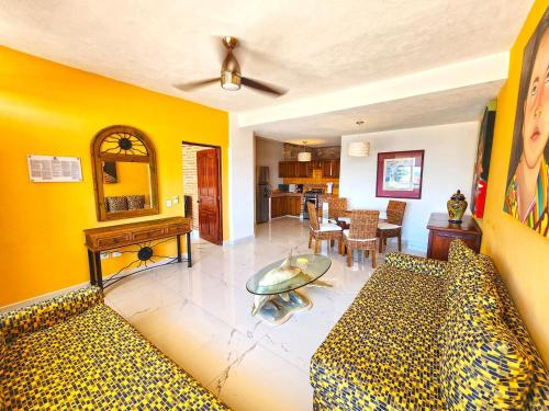 a living room with a couch and a table at Vallarta Shores Beach Hotel in Puerto Vallarta