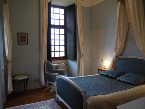 Postel nebo postele na pokoji v ubytování Chateau de Courseulles
