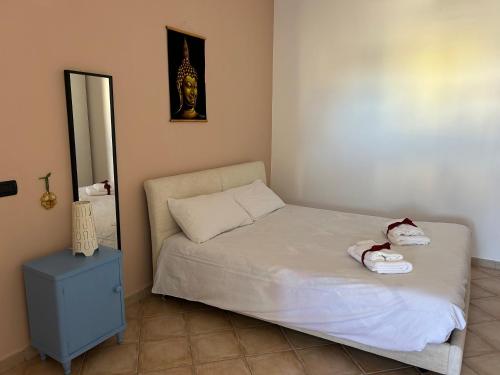 Ένα ή περισσότερα κρεβάτια σε δωμάτιο στο Salento Casa Vacanza Il Focolare