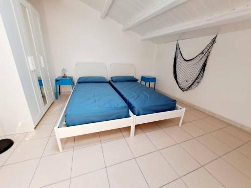 Ένα ή περισσότερα κρεβάτια σε δωμάτιο στο Casa Veronika di fronte al Mare