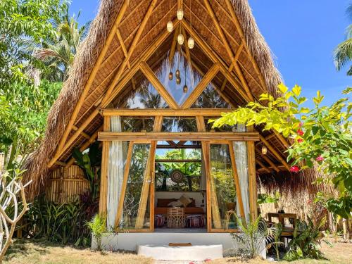 The Bamboo Houses – Tropical Garden & Empty Beach