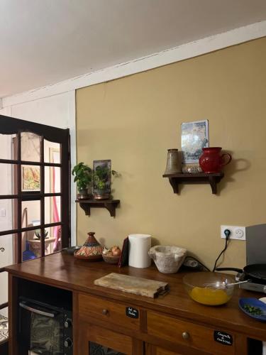 a kitchen with a wooden counter top in a room at Maison d'Hôtes & Savonnerie de Bonnefon in Saint-Chély-dʼAubrac