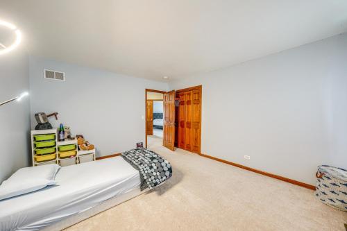 a bedroom with a large bed in a room at In-Home Theater Modern Naperville Vacation Rental in Naperville