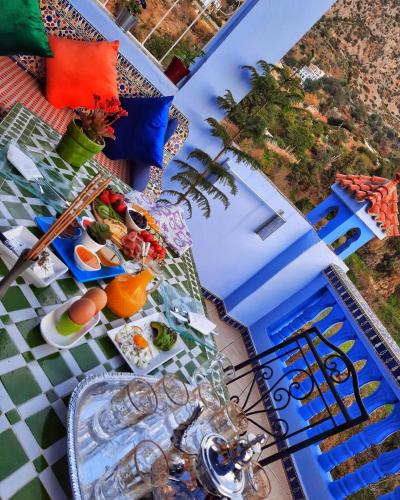 a table with plates of food on top of a table at Dar Jinane in Chefchaouene
