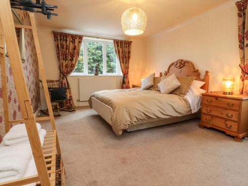a bedroom with a bed and a window at Linwood in Thornton
