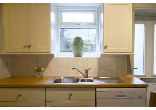 a kitchen with a sink and a window at The Beeches - Chatsworth Apartment No 1 - Sleeps 2 in Baslow