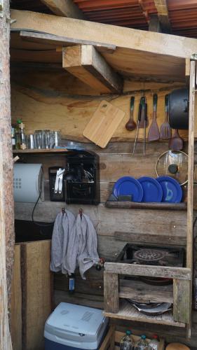 a kitchen with a toilet and some utensils at Auszeit inmitten der Natur - its a kind of magic 