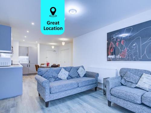 a living room with a couch and a chair at 2 bed 2 bath Modern Apartment in East Acton in London