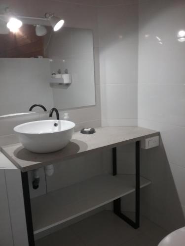 a bathroom with a bowl sink on a counter at Apparemment ChezTony Vue Montagne Eaux-Bonne Gourette in Eaux-Bonnes