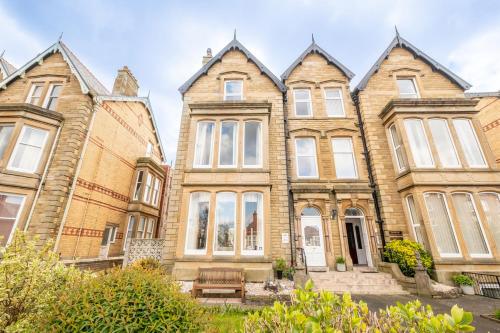 a group of houses in a row at Woodlands Holiday Apartments in Lytham St Annes