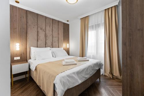 Postel nebo postele na pokoji v ubytování Dekaderon Lux Apartments