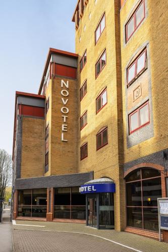 a large brick building with a hotel sign on it at Novotel Bristol Centre in Bristol