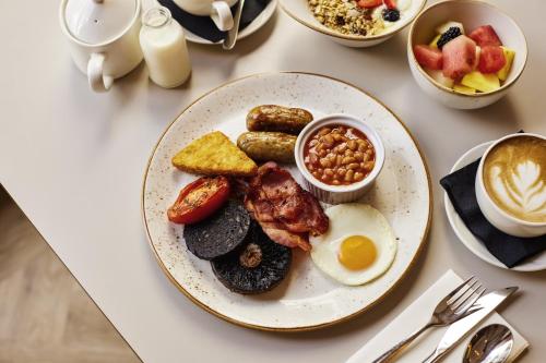 a plate of breakfast food on a table at Novotel Bristol Centre in Bristol