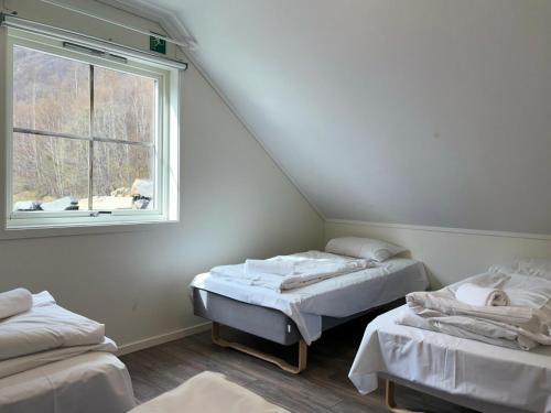 Postel nebo postele na pokoji v ubytování Brekke Apartments