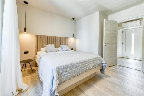 Posteľ alebo postele v izbe v ubytovaní Apartment Pasara