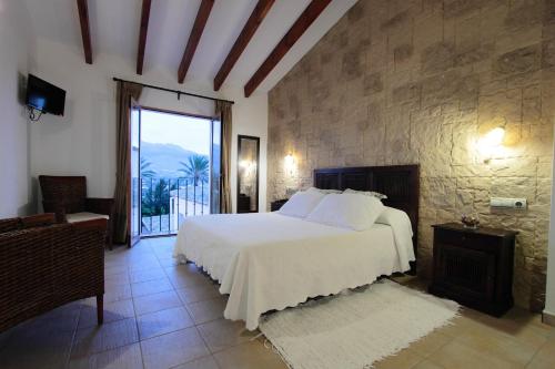 Ένα ή περισσότερα κρεβάτια σε δωμάτιο στο Hotel Tossal d'Altea