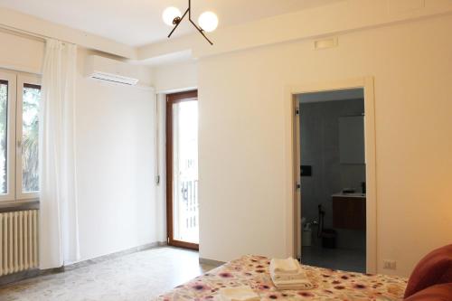 a bedroom with a bed and a large window at I Tre Cardilli in Matera