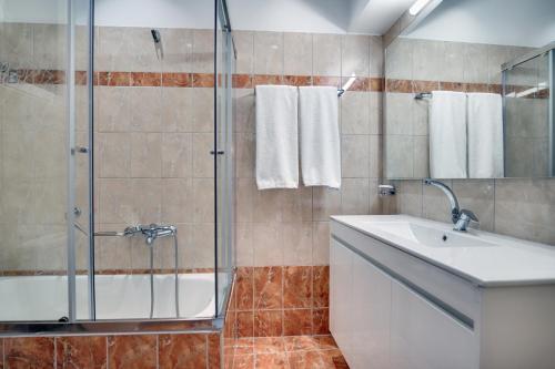 Koupelna v ubytování Palladion Hotel