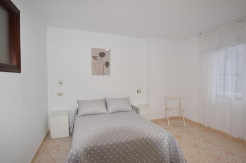 En eller flere senge i et værelse på Apartamento Mar Muxia