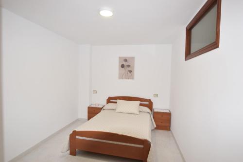 En eller flere senge i et værelse på Apartamento Mar de Muxía