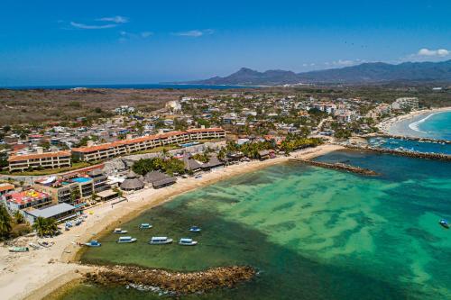 an aerial view of a beach with a resort at Casa Petosa - El Anclote in Punta Mita