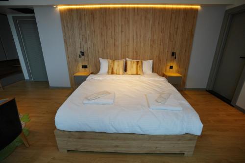 a large white bed in a room with two lamps at Dream house 22 in Istanbul