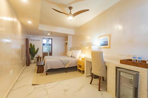 a hotel room with a bed and a fireplace at Casa Nawalli Puerto Vallarta Boutique Hotel - Adults Only in Puerto Vallarta