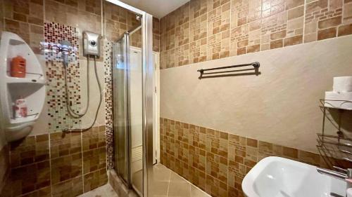 a bathroom with a shower and a sink at Single Home 2brs2baths Phuket Kathu Townkis in Ban Huai Luk (1)