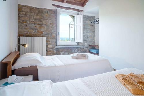 En eller flere senge i et værelse på La Torretta - ACrapa Mangia