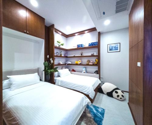 Ένα ή περισσότερα κρεβάτια σε δωμάτιο στο Q Kata Residence