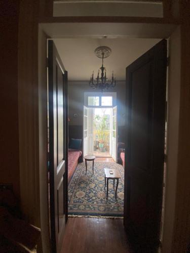 a hallway leading to a living room with a table at 10 Downtown in Cairo
