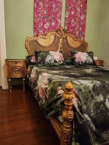 a bedroom with a bed with a canopy and a table at 10 Downtown in Cairo