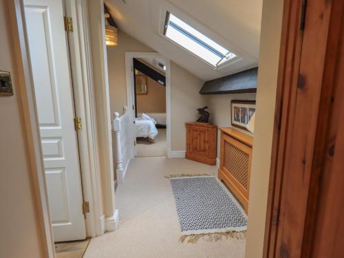 a hallway with a skylight in a house at Peak View in Keswick