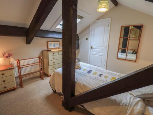 a bedroom with a bunk bed with a dresser and a drawer at Peak View in Keswick