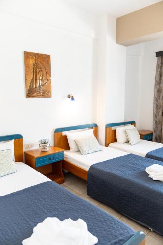 Postel nebo postele na pokoji v ubytování Villa Zeus INN