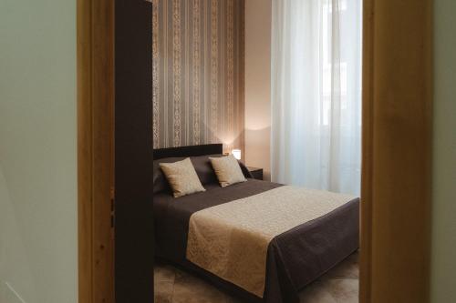 Una cama o camas en una habitación de Lifestyle and Suites