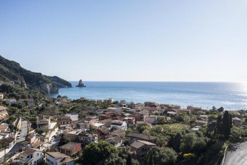 a small town on the shore of the ocean at Vicky's Apartments in Agios Gordios