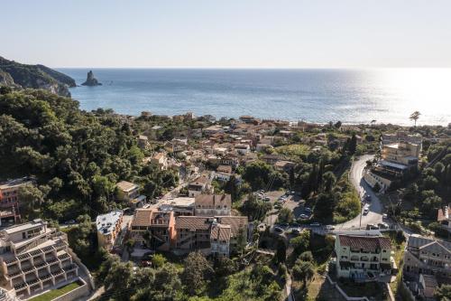 an aerial view of a town next to the ocean at Vicky's Apartments in Agios Gordios