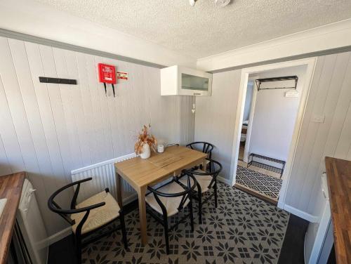 a small dining room with a table and chairs at Self-catering in Portree in Portree
